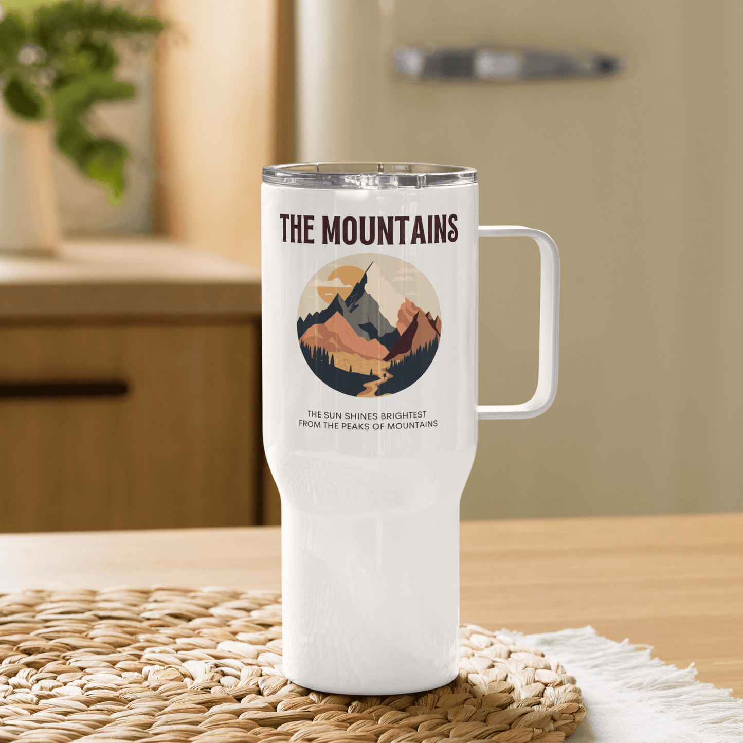 Travel mug with a handle 'The mountains. The sun shines brightest from the peaks of mountains'