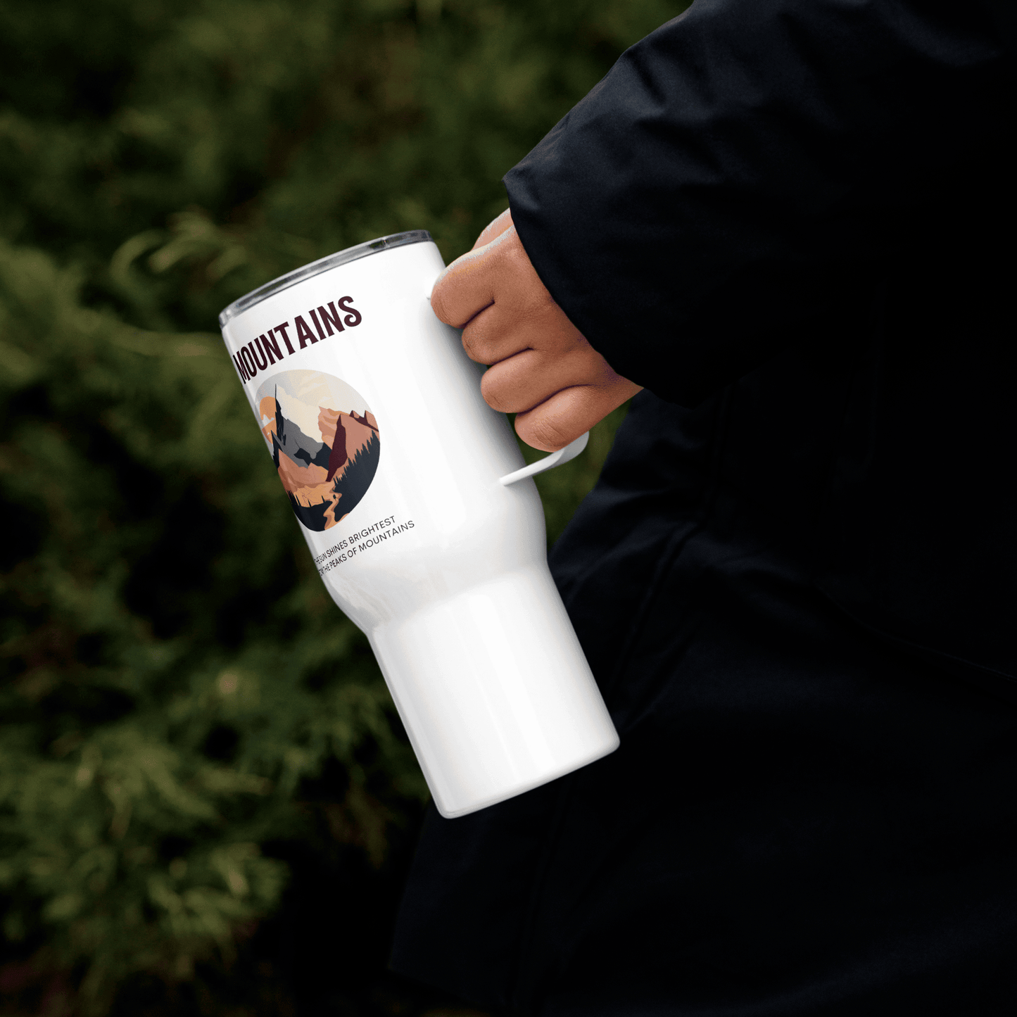 Travel mug with a handle 'The mountains. The sun shines brightest from the peaks of mountains'