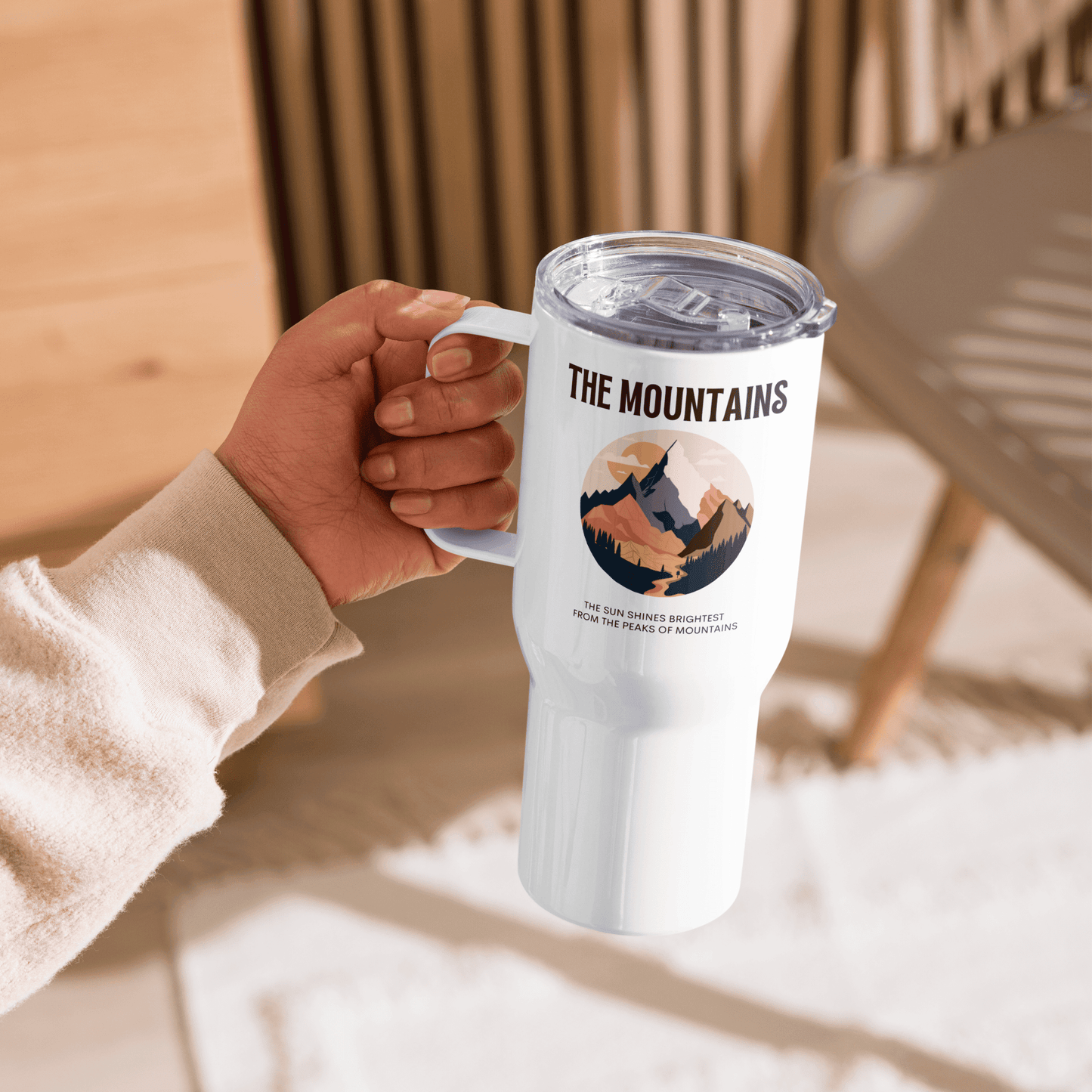 Travel mug with a handle 'The mountains. The sun shines brightest from the peaks of mountains'